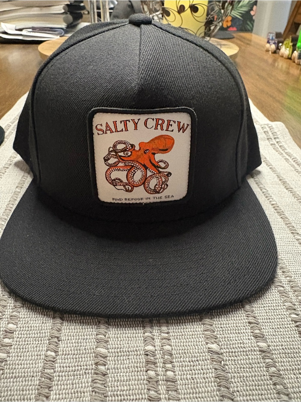 Salty Crew Black Snapback Hat with Orange Octopus Patch